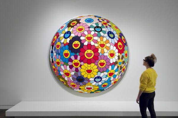 Visitor viewing the Emojiflowers exhibit at the National Nordic Museum in Ballard