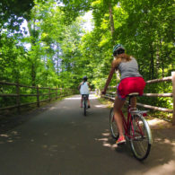 Child and parent biking on family-friendly trail near Seattle
