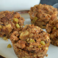 Individual Thanksgiving “stuffins” baked in a muffin tin, showing golden crispy edges and a mix of bread, pancetta, apples, and fennel.