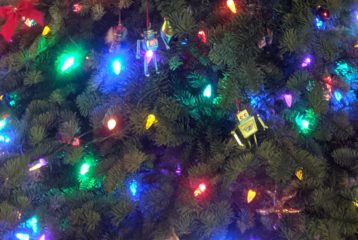 Close-up of glowing holiday lights on a Christmas tree