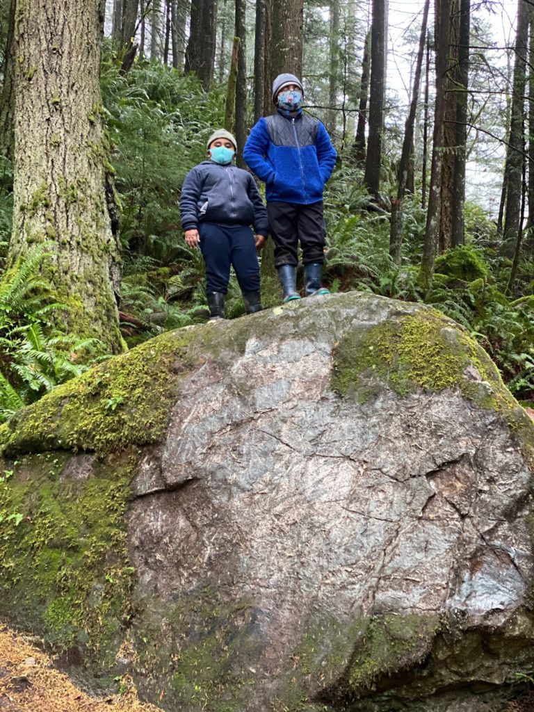 Two boys on boulder
