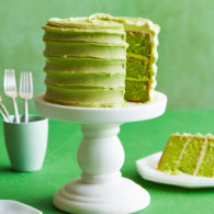 Green cake with slice missing