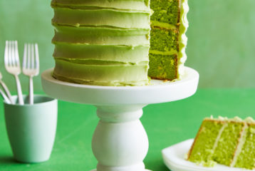 Green cake with slice missing
