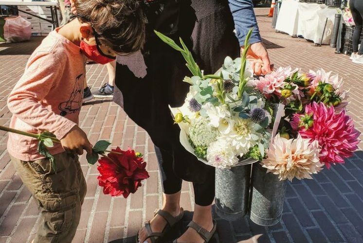 Picking up flowers at the Farmers Market