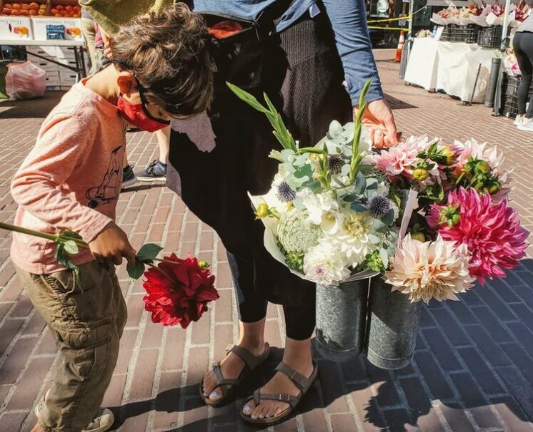 Picking up flowers at the Farmers Market