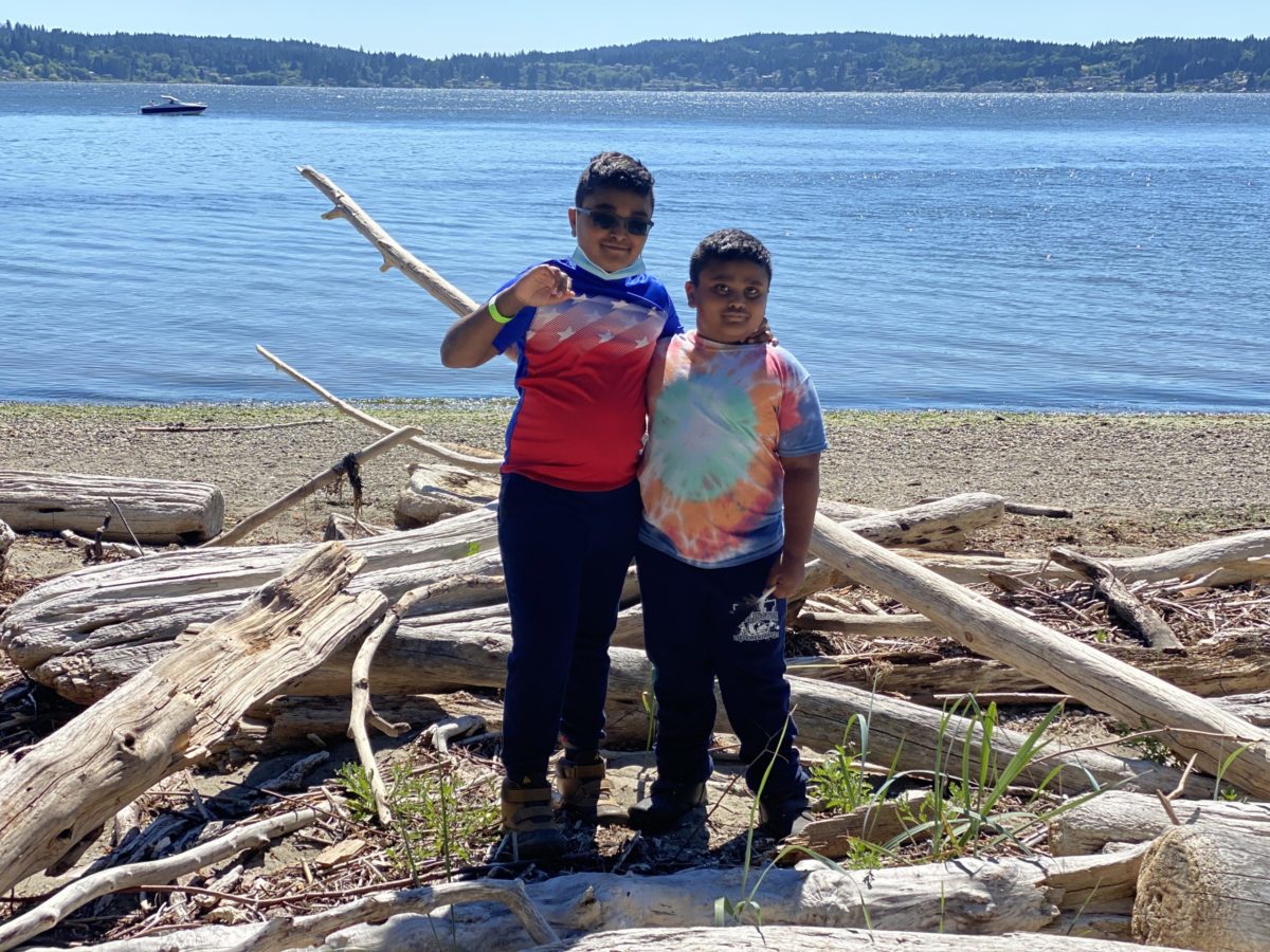 Boys standing at the Blake Island Beach