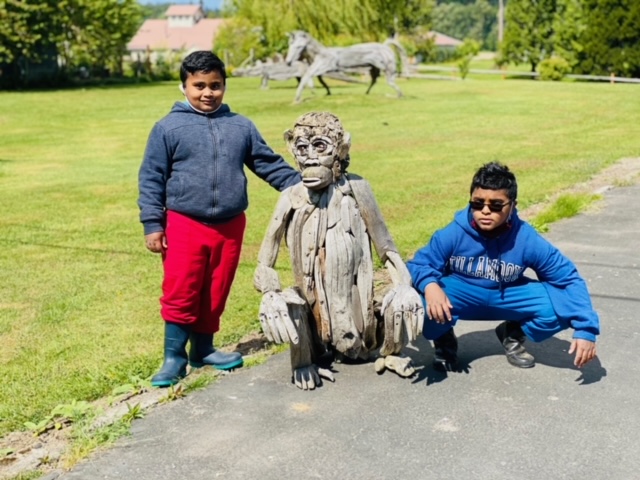 Posing with the gorilla sculpture