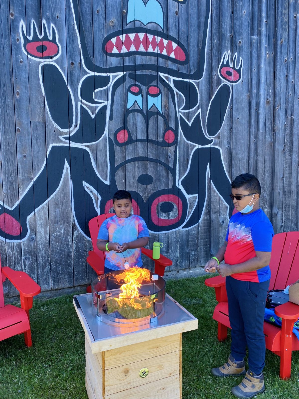 Roasting s'mores on the fire