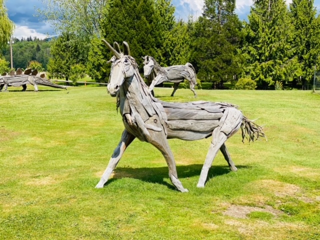 A long-horned unicorn stands, ready to run.