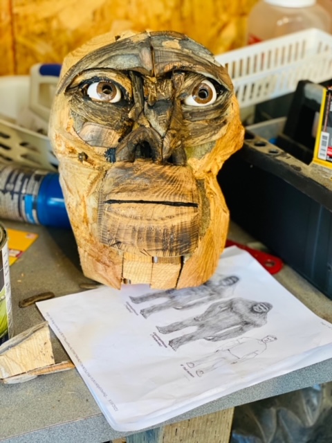 Sasquatch head made from driftwood. Eye sockets were carved into the wood along with a nose and mouth.