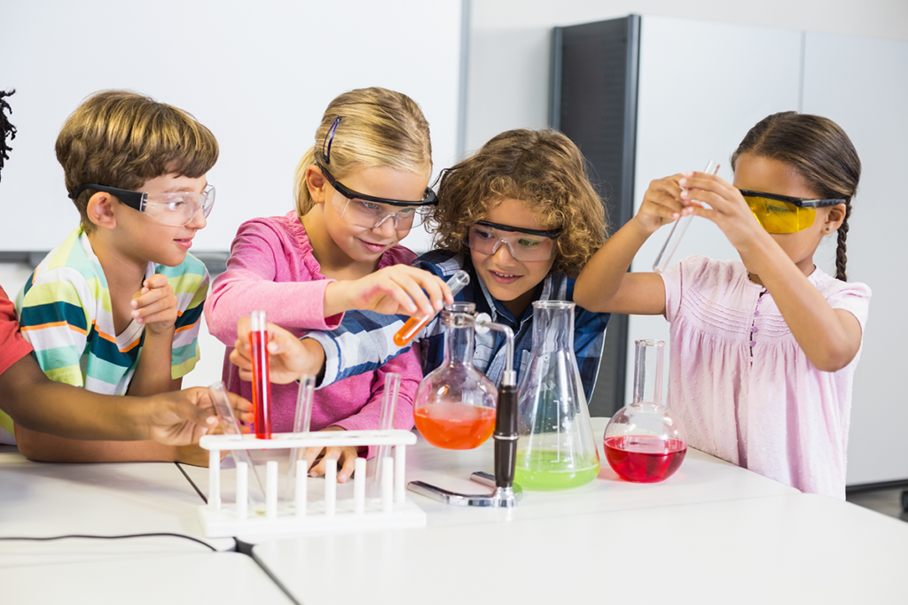 Cascade Enrichment - Students looking at liquid in beakers