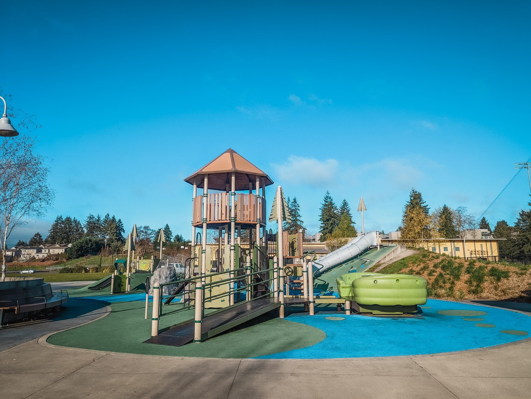 Large playground structure against blue skies 