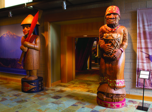 Welcome figures at the entrance of the Hibulb Cultural Center in Tulalip, Washington