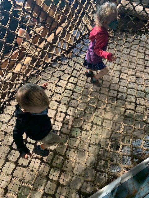Climb the rope bridge leading to other parts of the museum