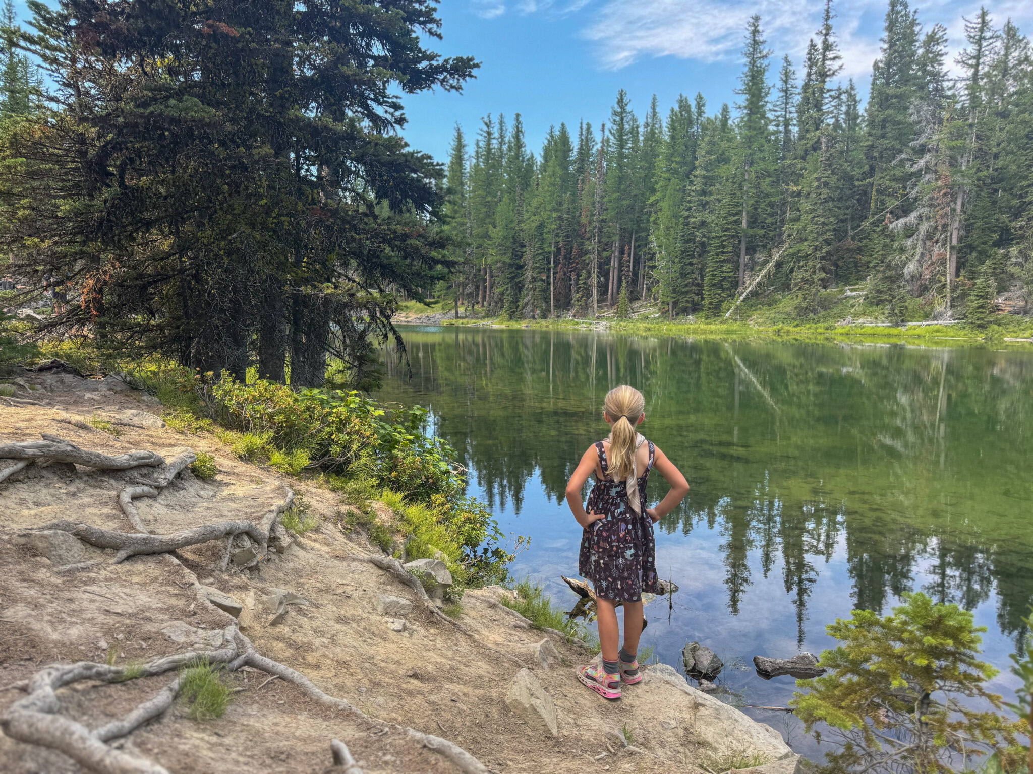 Girl looking out at fall colors at Clara and Marion Lakes trail