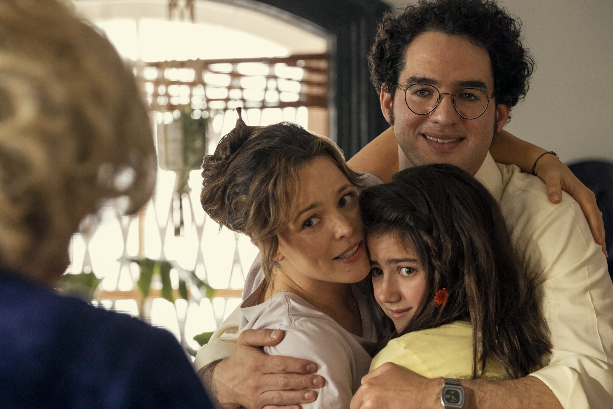Margaret and her family hugging