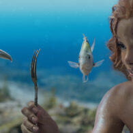 The Little Mermaid and her pals look at an unusual object - a fork