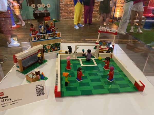 The new LEGO set has female soccer minifigures, a goal, and an audience