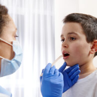 There's a national amoxicillin shortage. A pediatrician examines a throat for signs of strep