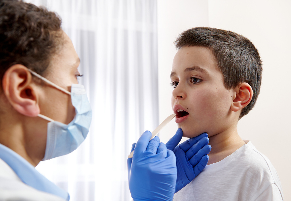 There's a national amoxicillin shortage. A pediatrician examines a throat for signs of strep