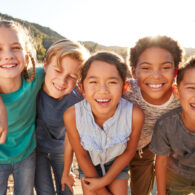 Apex Social Group - Children smiling at camera