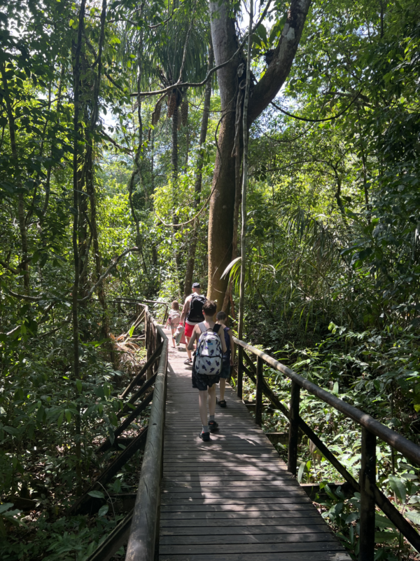 Family walking across a bridge- activities are based around the time of day where the neurodiverse child has the most patience.