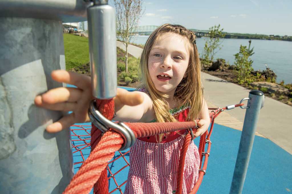 Girl playing on the playground at the Vancouver, Washington waterfront