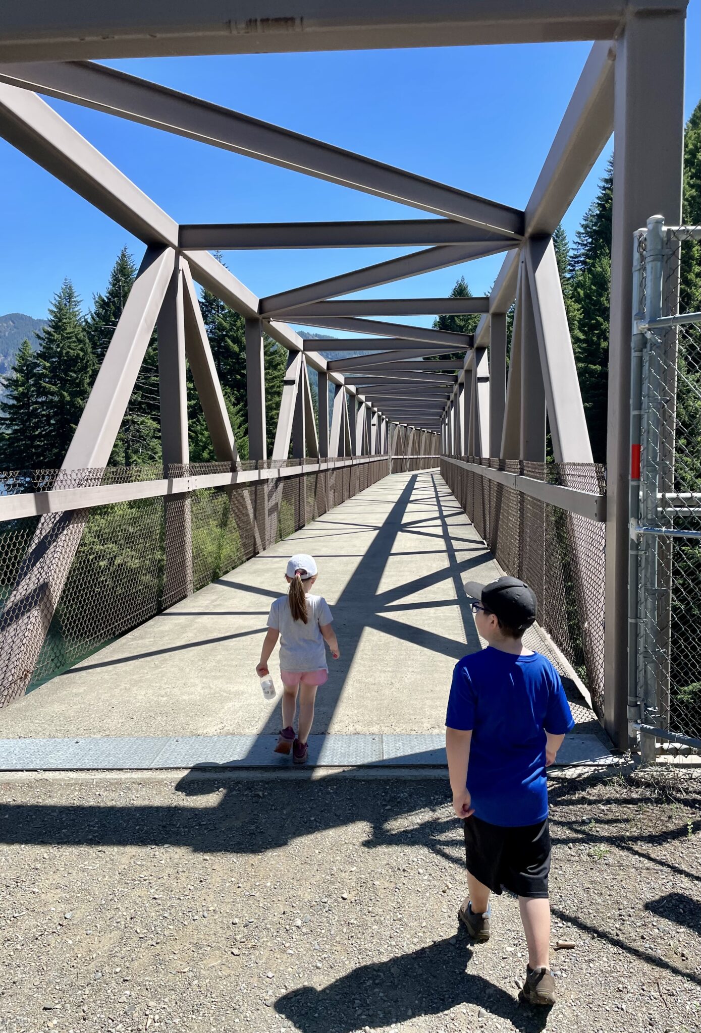 Kids crossing over a bridge on a walk around Lake Easton State Park.