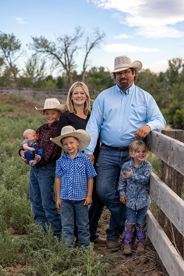 Nicole Derting with her husband and children. She and her husband run Post 5 Cattle Company.