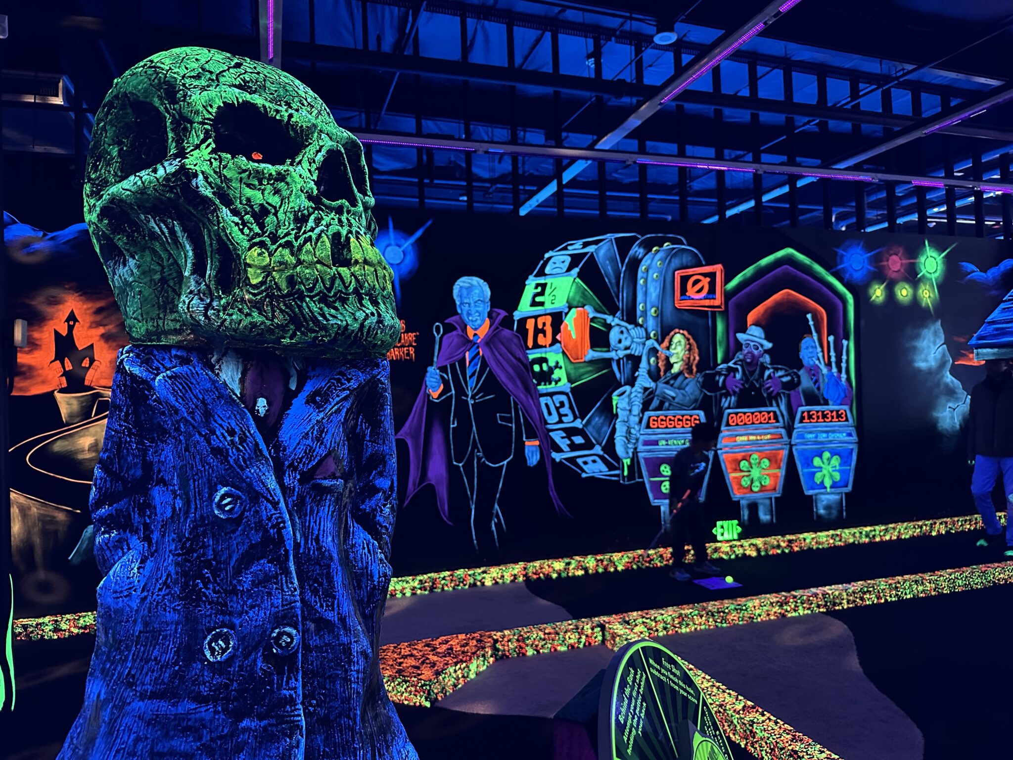 Glow in the dark decorations around a mini gold course