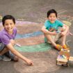 Agu and Mateo get creative with chalk at Bellevue Arts Fair