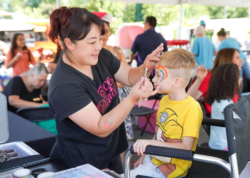 Hopelink Neighborhood Fair 2023. Face painting. Photo by Alabastro