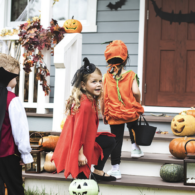 Kids in costumes trick-or-treating during a free Halloween event in Seattle.