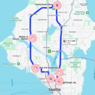 Google maps image of the greater Seattle area, with a route traced in the shape of a circle from Capitol Hill, up to Northgate, southwest to Ballard, and finishing back at Queen Anne. Pink donut graphics dot the path indicating the stops along the trail.