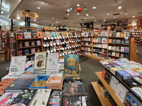 Interior of Third Place Books, showing racks of books in the kids section. 