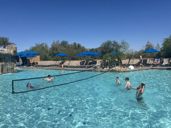 Kids playing in a hotel pool.