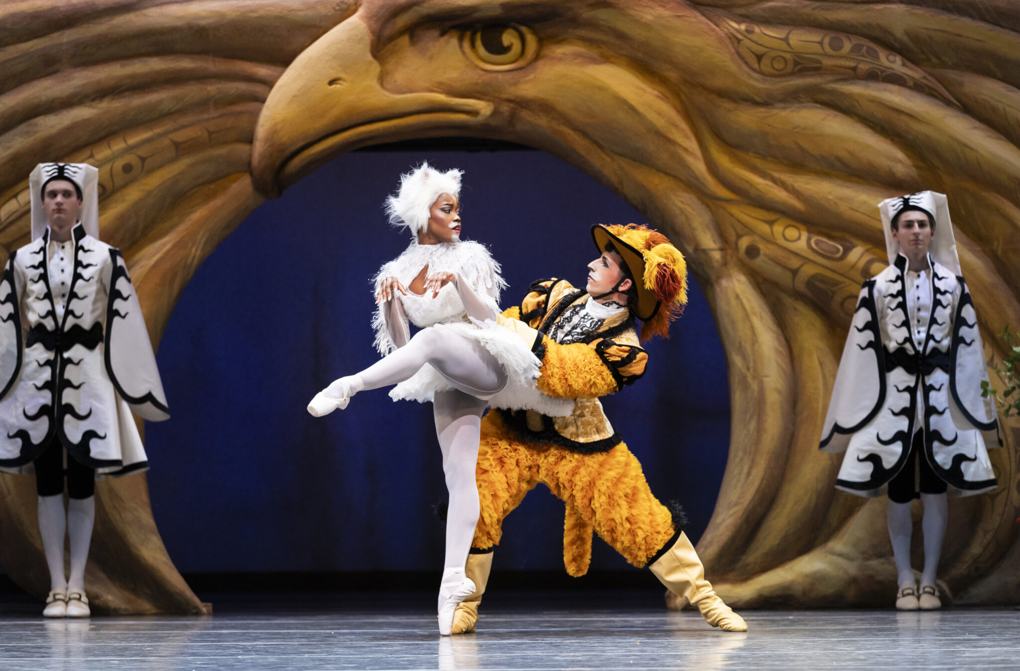 Two ballerinas dance together, dressed as Puss and Boots
