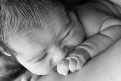 Newborn sleeping on chest