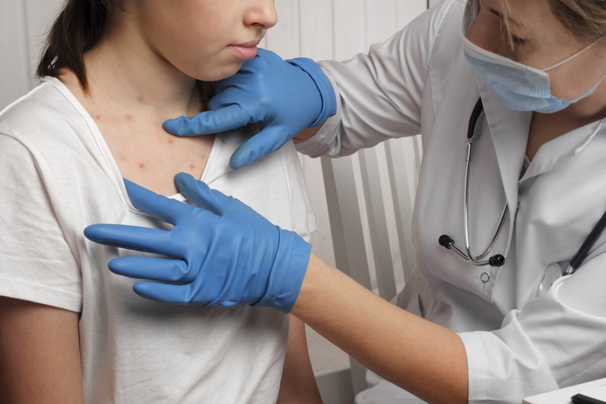 Child getting vaccinated against measles, MMR shot prevention