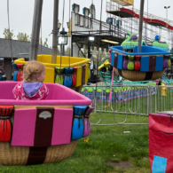 Kid rides in hot air balloon cart