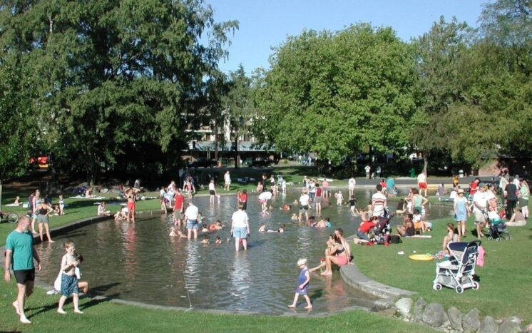 Green Lake Wading Pool on a hot summer day full of waders.