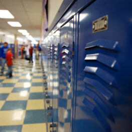 Empty school hallway lined with lockers, symbolizing the start of the school year.