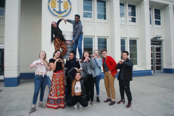 MOHAI Youth Advisors team photograph in front of MOHAI main entrance.