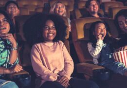 People kids watching movie in movie theater istock