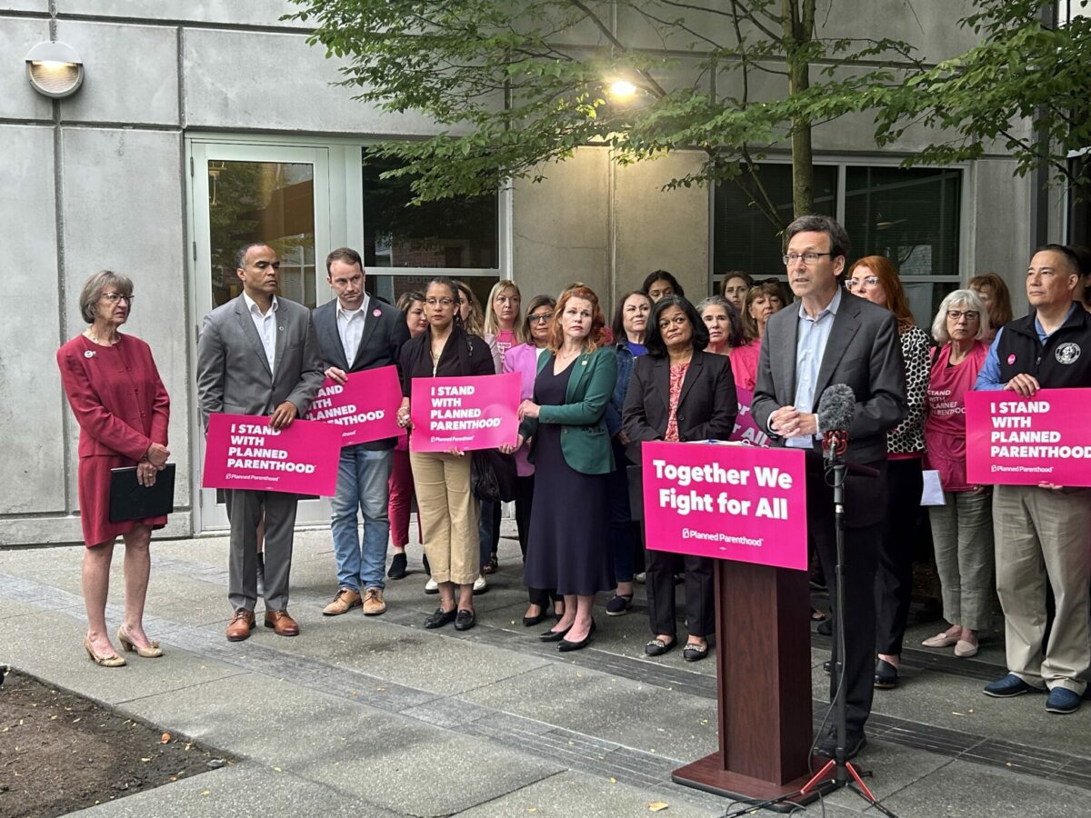 Washington Gov. Bob Ferguson speaks outside a Seattle Planned Parenthood clinic about funding support.