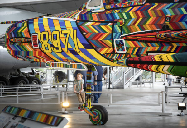 Child observing the nose of the beaded MiG-21 plane at Museum of Flight