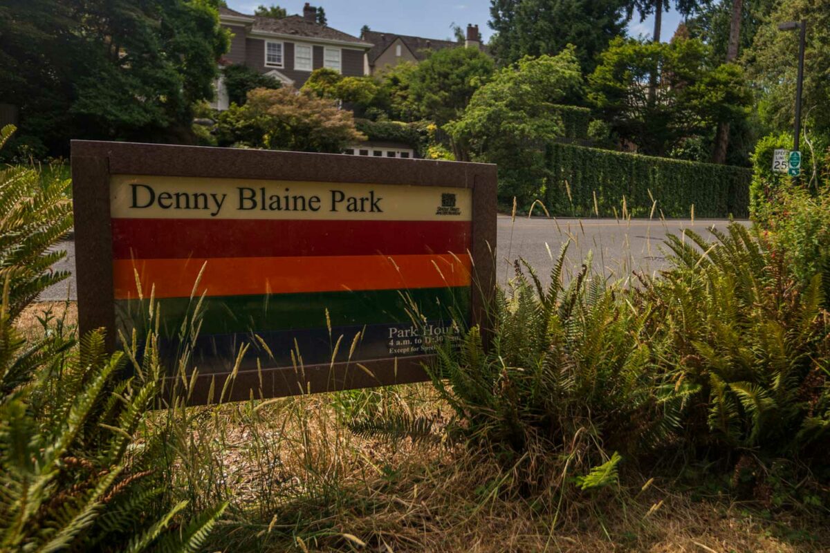 Denny Blaine Park entrance sign with greenery in the background
