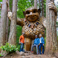 Seattle troll surrounded by volunteers