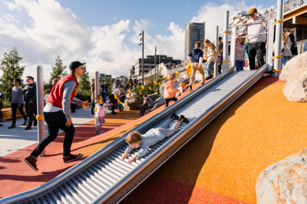 Kids explore the new slide at Overlook Park above the Seattle Aquarium.