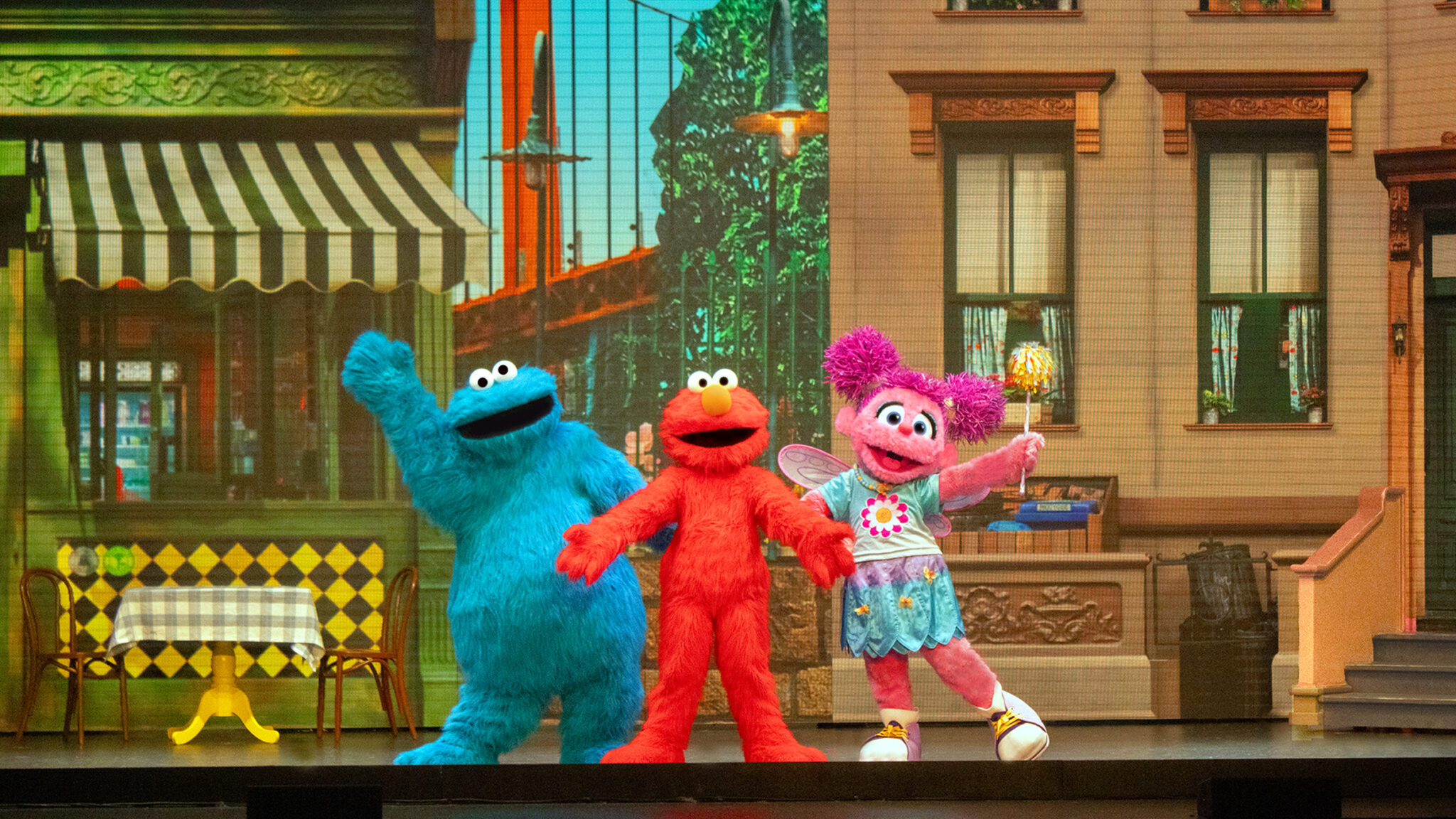 Elmo and Cookie Monster on stage in Sesame Street Live show.